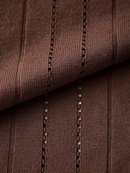 Close up of the vertical pointelle openwork ladders of the knit dress