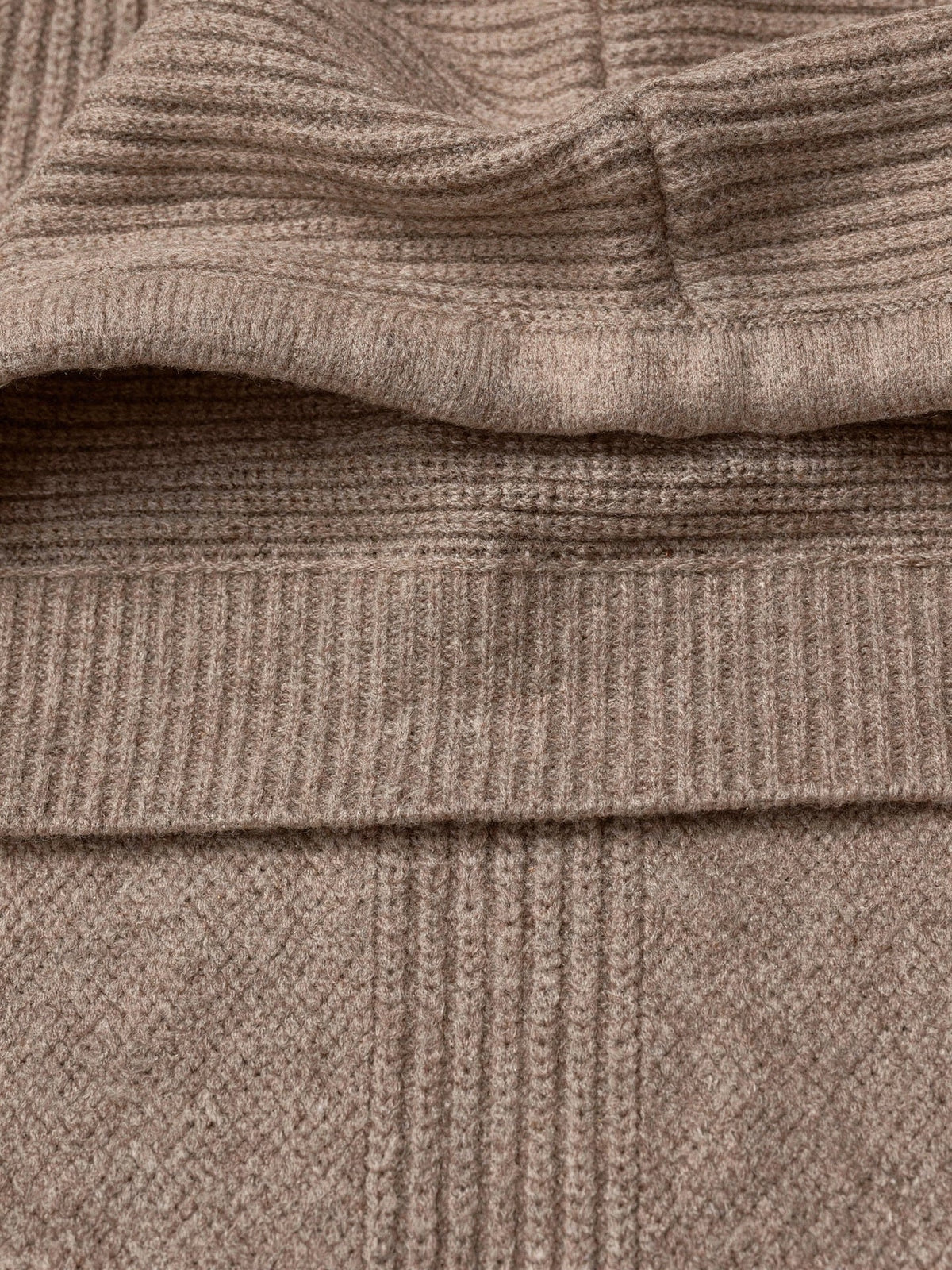 Close-up of the fine vertical rib knit and folded hood edge of the Didbrook knitted hood