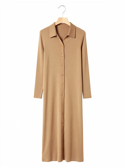 Knitted shirt dress in Biscuit on a wooden hanger, buttoned from collar to hem