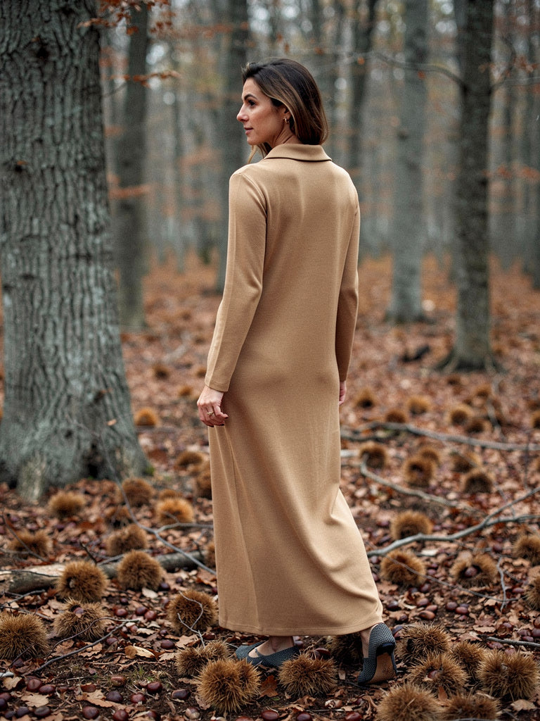 Back of the knitted shirt dress showing the straight column and ankle length hem