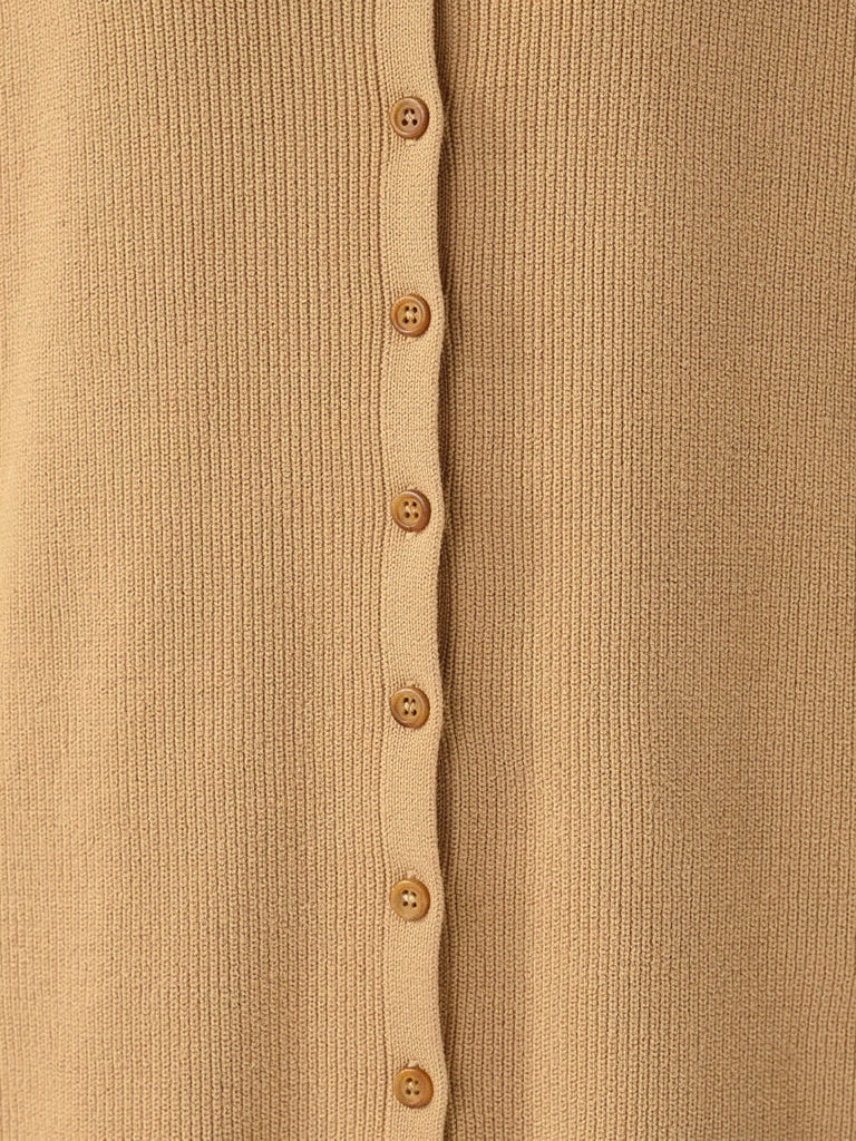 Close up of the fine cotton rib knit and the tonal buttons of the shirt dress