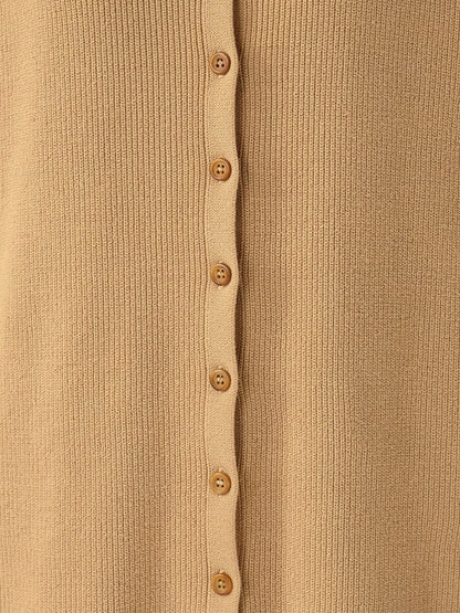 Close up of the fine cotton rib knit and the tonal buttons of the shirt dress