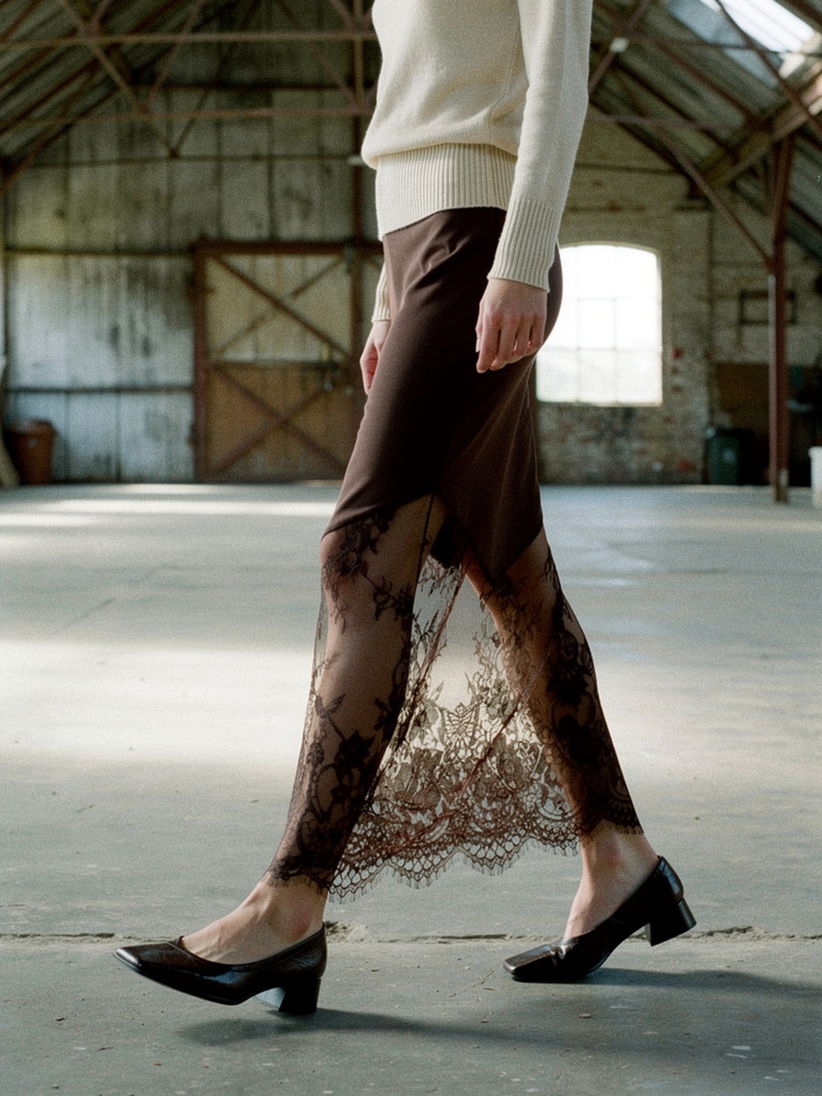 Chestnut lace maxi skirt seen from the side, sheer lace hem in movement