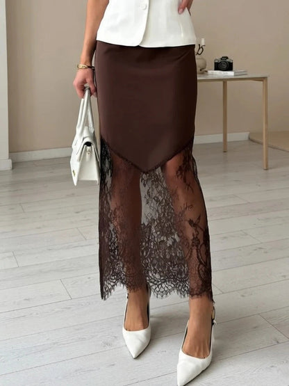 Chestnut lace maxi skirt worn with heels, showing how sheer the lace hem is