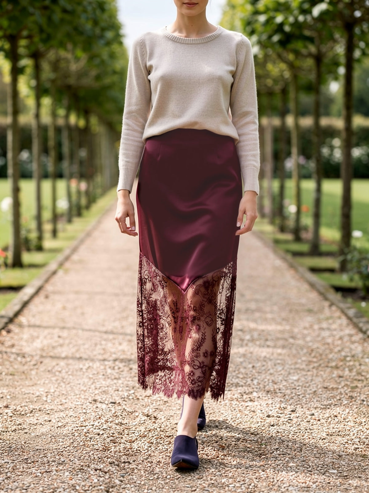 Damson lace maxi skirt worn on a pleached lime walk, sheer lace hem over the ankle