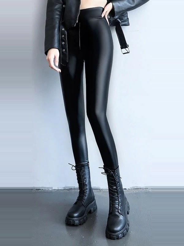 Onyx leather-look leggings worn full length with lace-up boots
