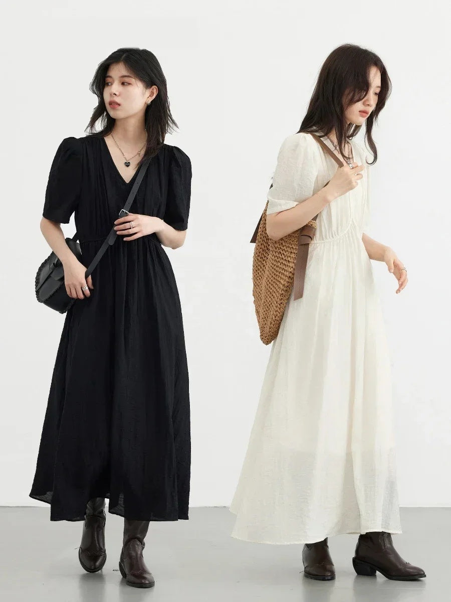 The long dress shown in both colours, Black and Candlelight, worn full length