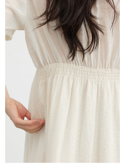 Shirred elastic back waist of the long dress in Candlelight, with the skirt gathered below it