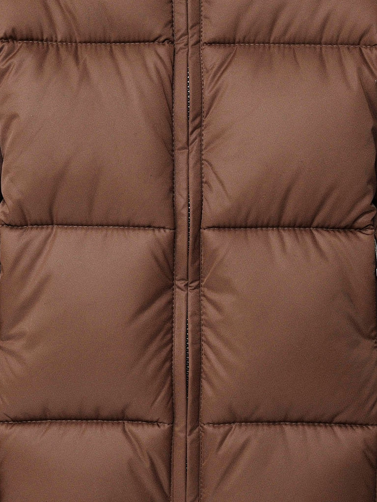 Close up of the large box quilting and the centre zip on a brown puffer coat