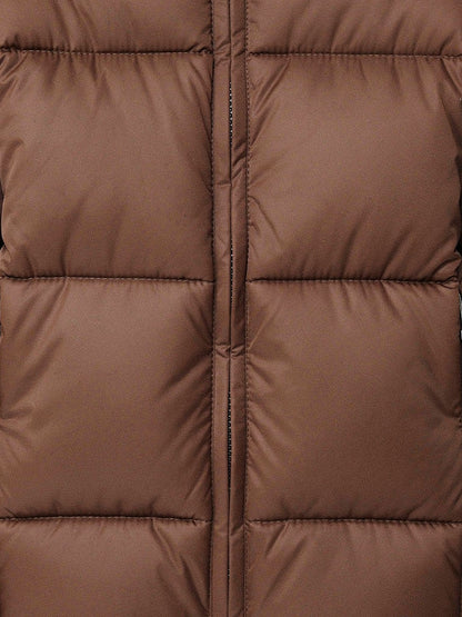 Close up of the large box quilting and the centre zip on a brown puffer coat