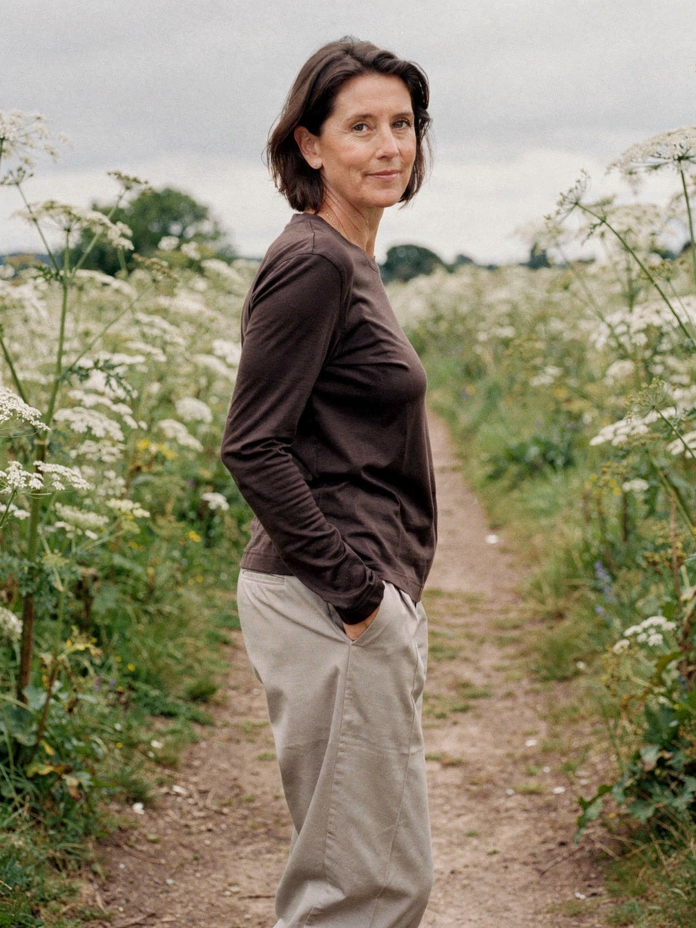 Womens long sleeve top in espresso lyocell jersey, worn on a country lane