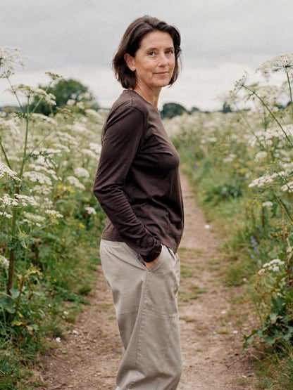 Womens long sleeve top in espresso lyocell jersey, worn on a country lane