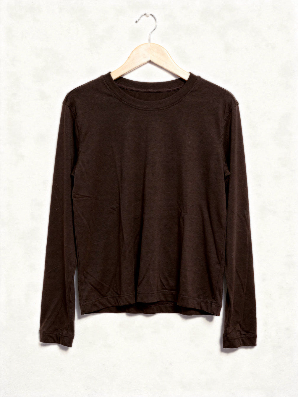 Espresso long sleeve top in smooth lyocell jersey, front view on a hanger
