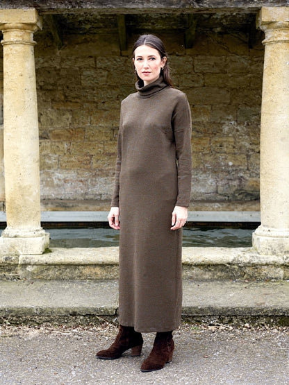 Maxi jumper dress in Hessian worn at a village stone wash house, front view, full length
