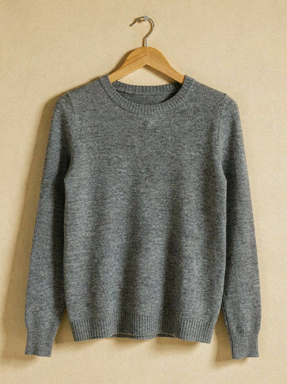 Grey marl merino wool crew neck jumper on a wooden hanger