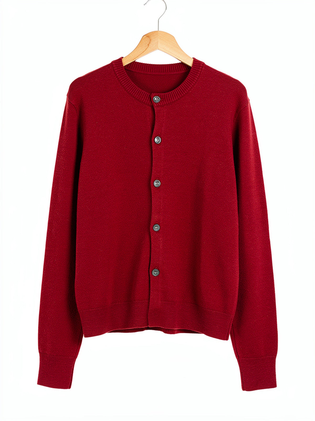 Burgundy merino wool cardigan in Cranberry, front view on a wooden hanger
