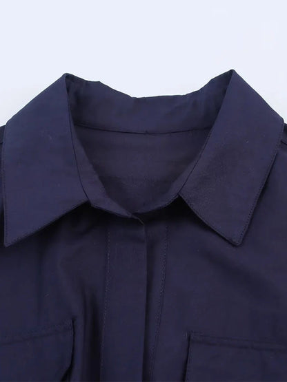 Collar and flap chest pockets of the navy shirt dress