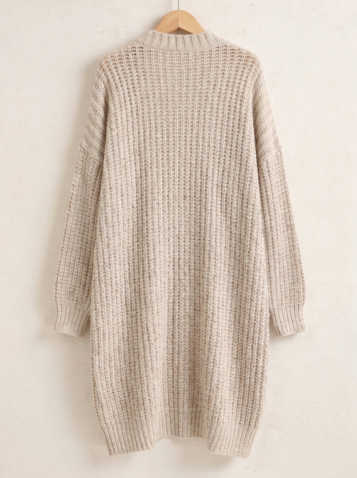 Oatmeal longline open front chunky rib cardigan on a hanger