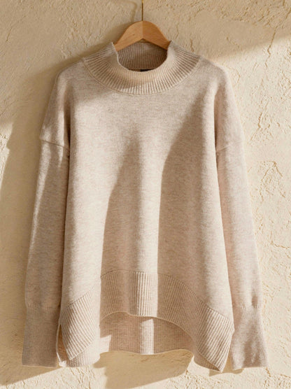 Oatmeal oversized funnel neck jumper with ribbed collar, split hem and dipped back, on a hanger