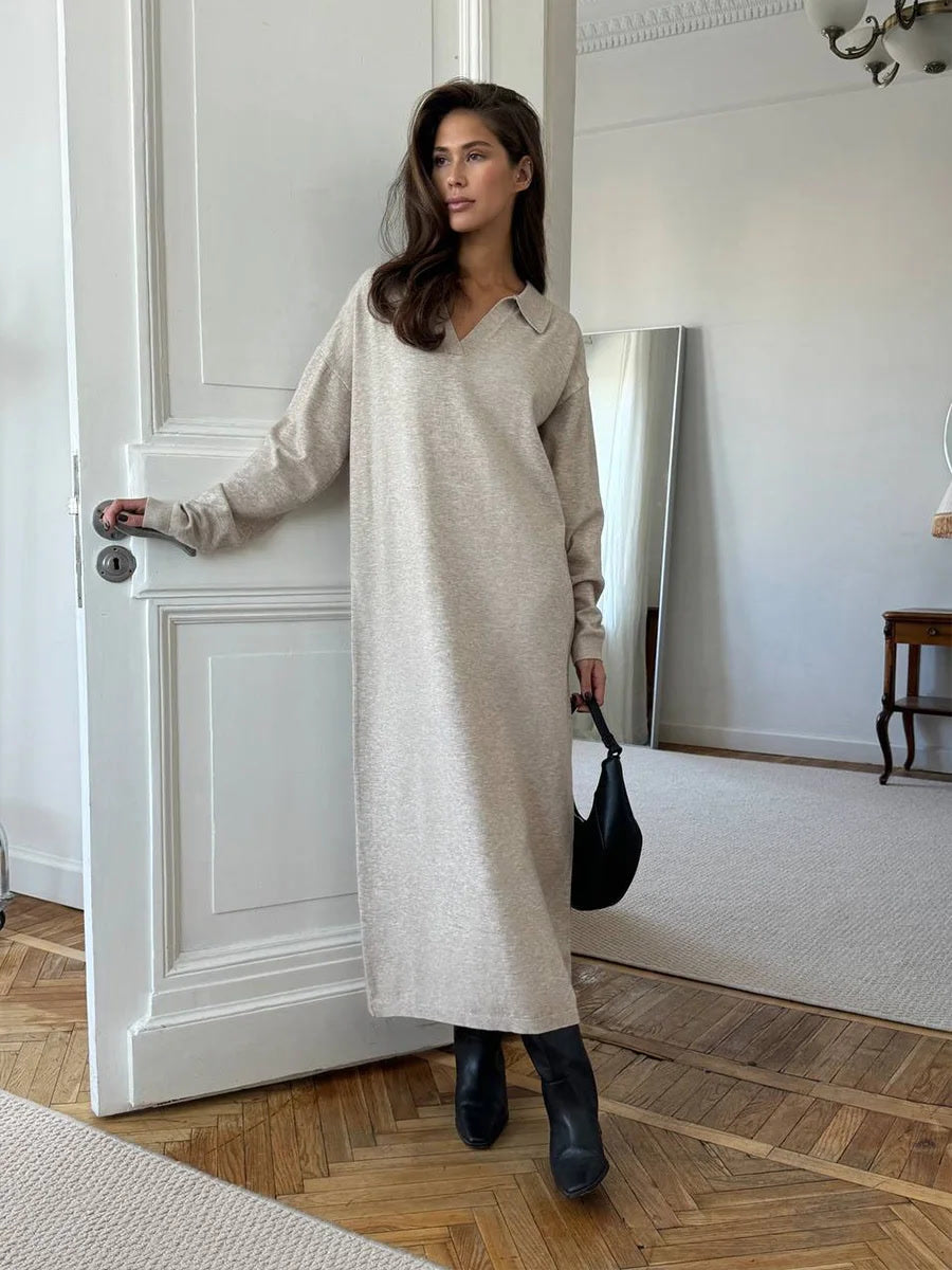 Oversized jumper dress in Oat Marl worn full length with ankle boots