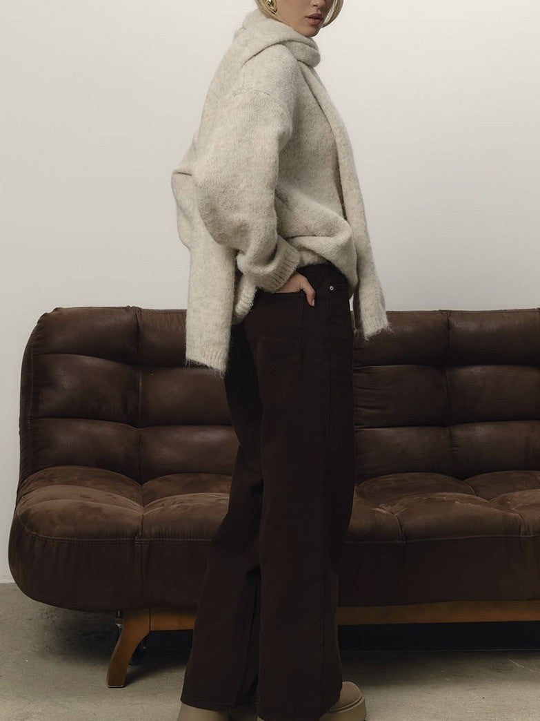 Oversized jumper and matching scarf in Rushlight cream seen from the side, showing the dropped shoulder