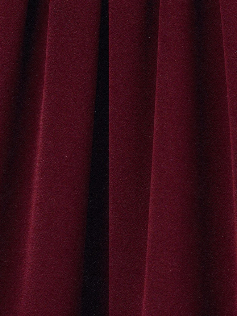 Close up of the matte crepe cloth of the palazzo trousers, opaque with a fine grain