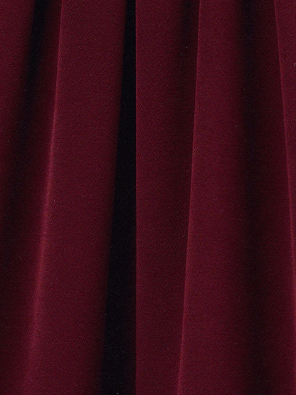 Close up of the matte crepe cloth of the palazzo trousers, opaque with a fine grain