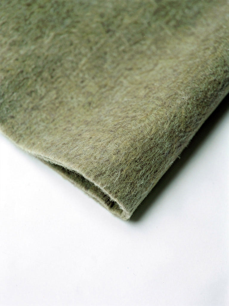 Close up of the double faced brushed wool cloth and its clean cut unlined edge