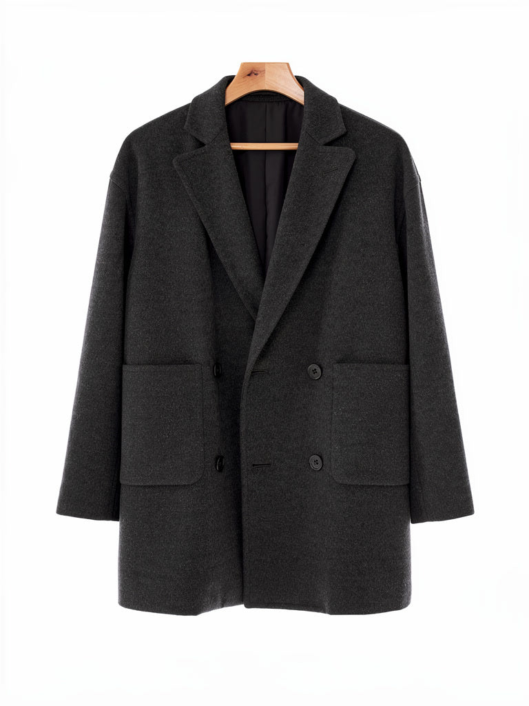 Double breasted wool pea coat in Graphite charcoal on a hanger, front view