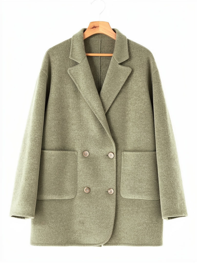Double breasted pea coat in Lichen double faced wool on a hanger, notch lapels and patch pockets