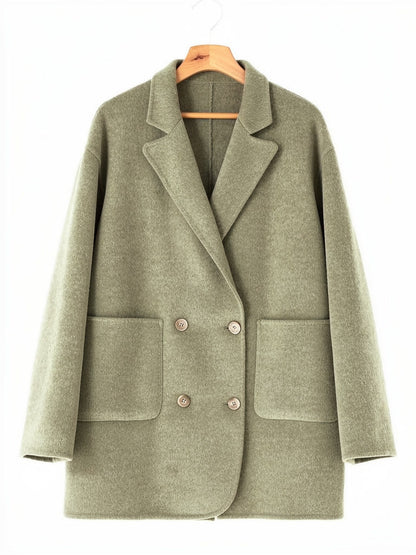 Double breasted pea coat in Lichen double faced wool on a hanger, notch lapels and patch pockets