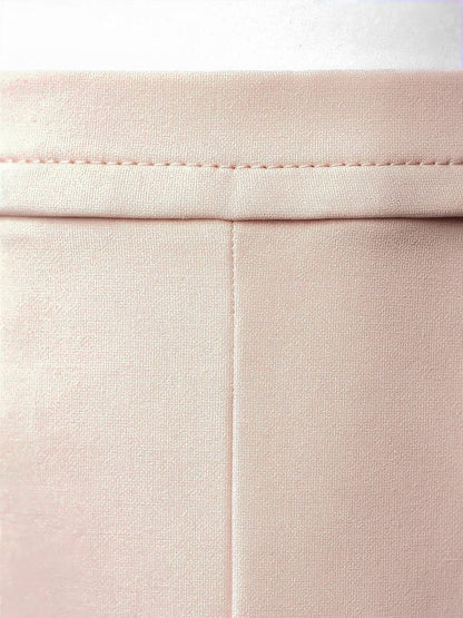 Close view of the smooth matte cloth and the waistband seam of the Aylworth pencil skirt