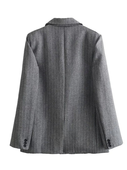 Back view of the grey pinstripe blazer showing the centre vent