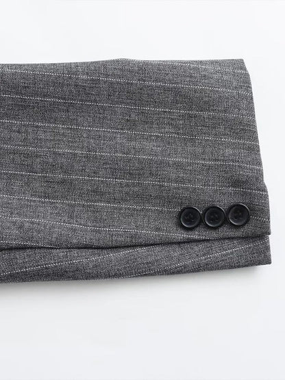 Cuff of the pinstripe blazer with three buttons
