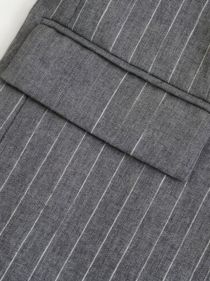 Close up of the chalk stripe suiting and hip flap pocket of the pinstripe blazer