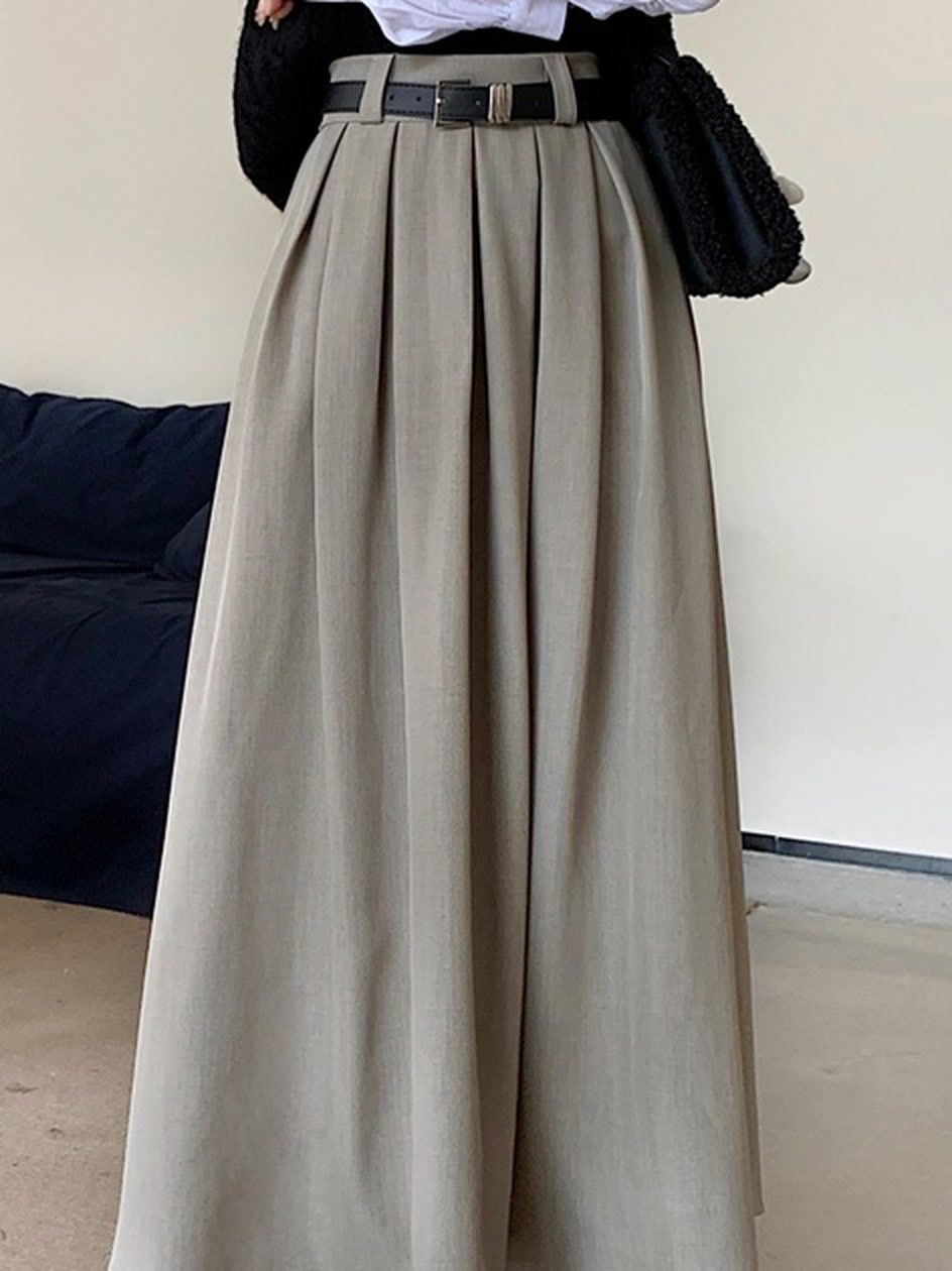 Belt loops and box pleats on the greige midi skirt, supplier photograph