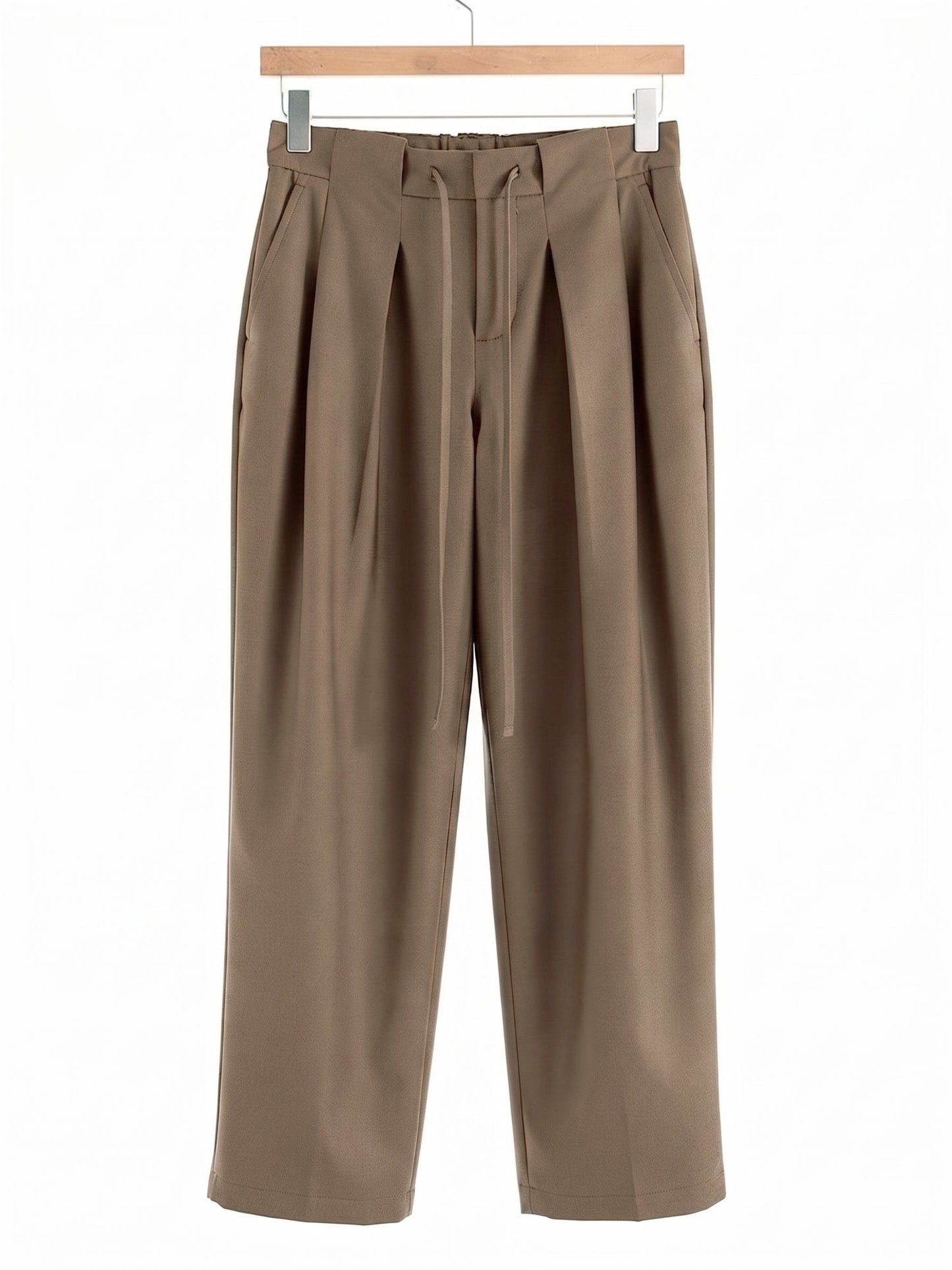 Nutmeg pleated trousers on a hanger, front view