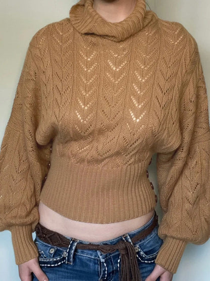 Front view of the camel pointelle roll neck jumper worn with jeans