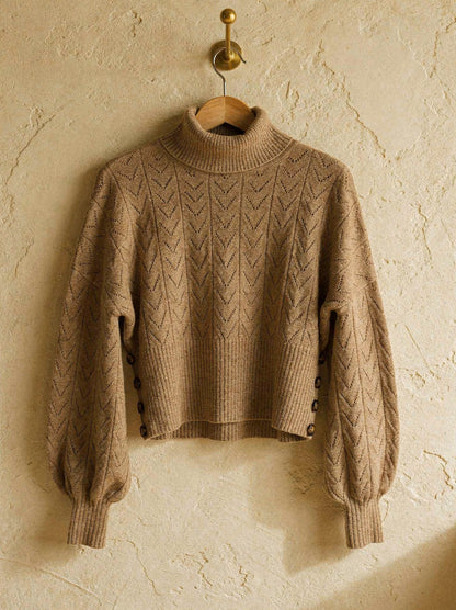 Camel pointelle roll neck jumper with batwing sleeves and buttoned ribbed waistband, on a hanger