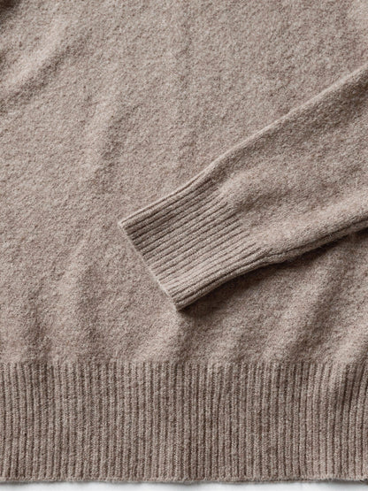 Close-up of the deep ribbed cuff and the soft brushed halo of the polo neck jumper