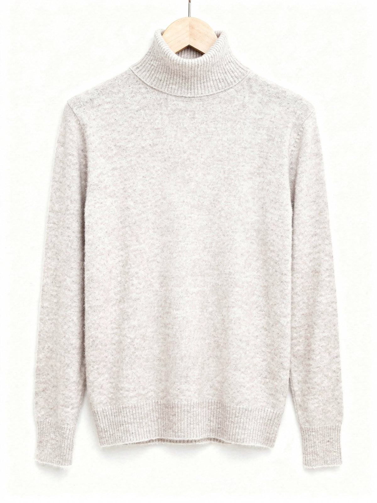 Limewash polo neck jumper on a hanger, fine brushed knit with a tall folded roll neck and deep ribbed cuffs