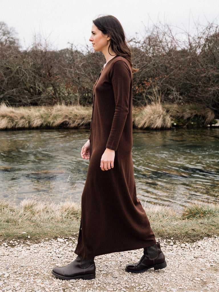Ribbed maxi dress in Dark Chocolate worn walking beside a village ford