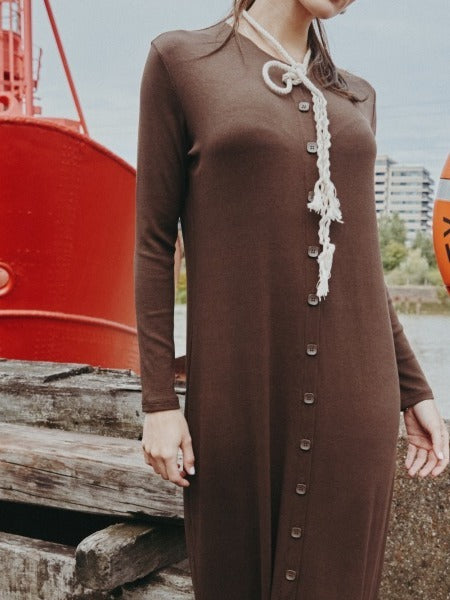Button-through front of the ribbed maxi dress in Dark Chocolate, worn