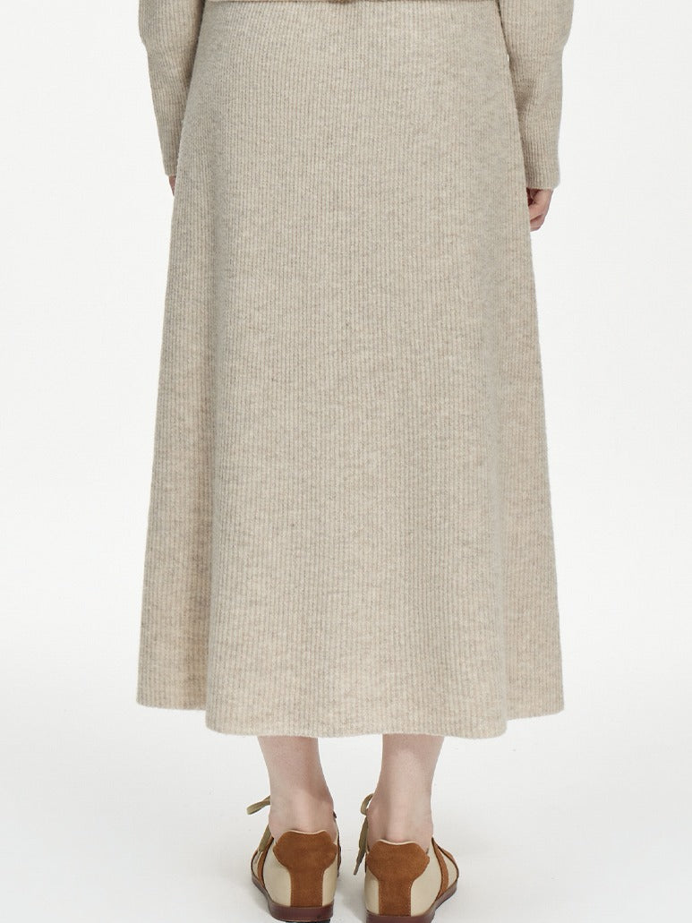 Supplier photograph of the back of the knitted skirt, with no zip, no seam and no slit anywhere in the ribbed A-line body