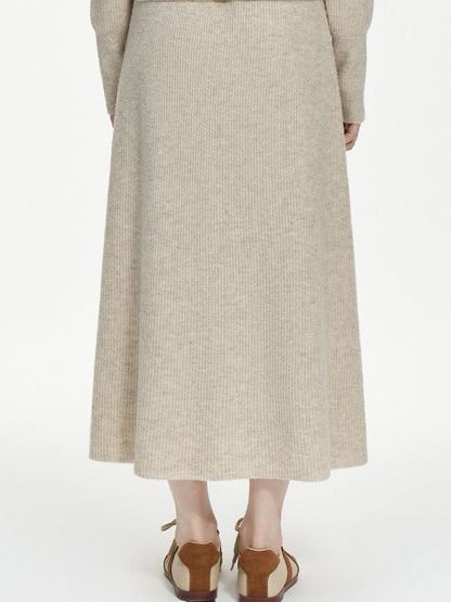 Supplier photograph of the back of the knitted skirt, with no zip, no seam and no slit anywhere in the ribbed A-line body