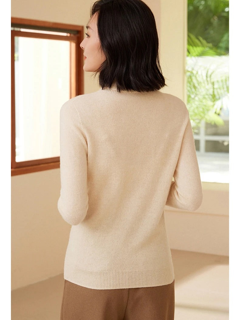 Roll neck jumper in Barley seen from the back, showing the ribbed hem