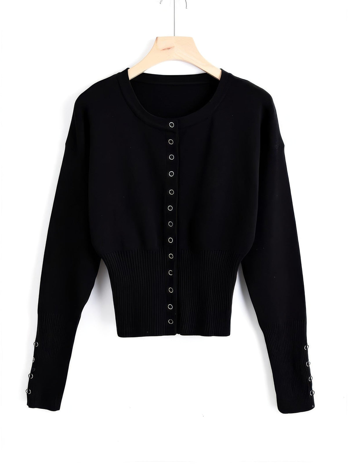 Cropped round-neck cardigan in Jet Black on a hanger, thirteen silver press studs