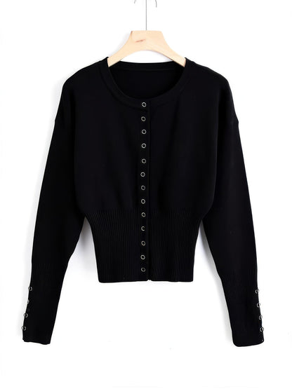 Cropped round-neck cardigan in Jet Black on a hanger, thirteen silver press studs