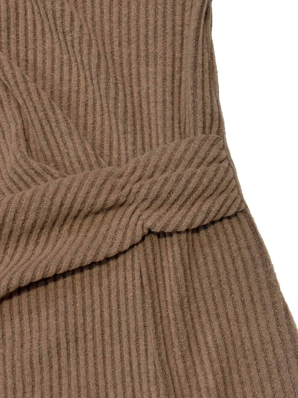 Close-up of the self-fabric twist knot at the waist of the ruched midi dress