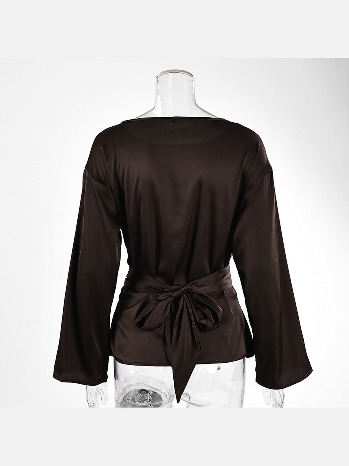 Chocolate satin blouse photographed from the back, the sash knotted into a soft bow